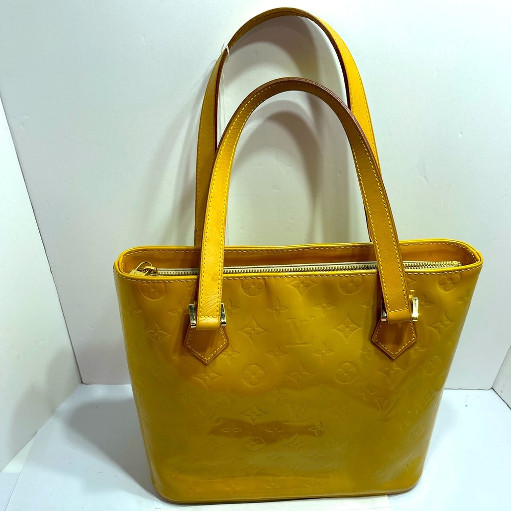 Louis Vuitton Houston in Vernis Yellow comes with dust bag.